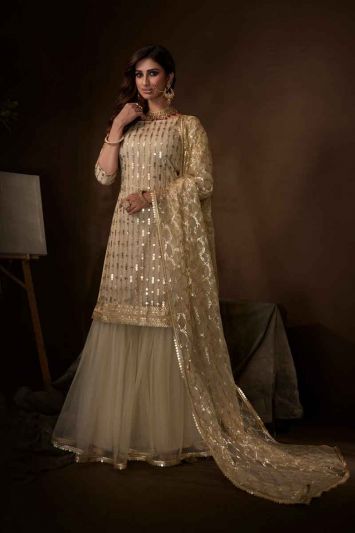 Off White Net Heavy Designer Sharara Suit With Jari Embroidery And Sequence Work